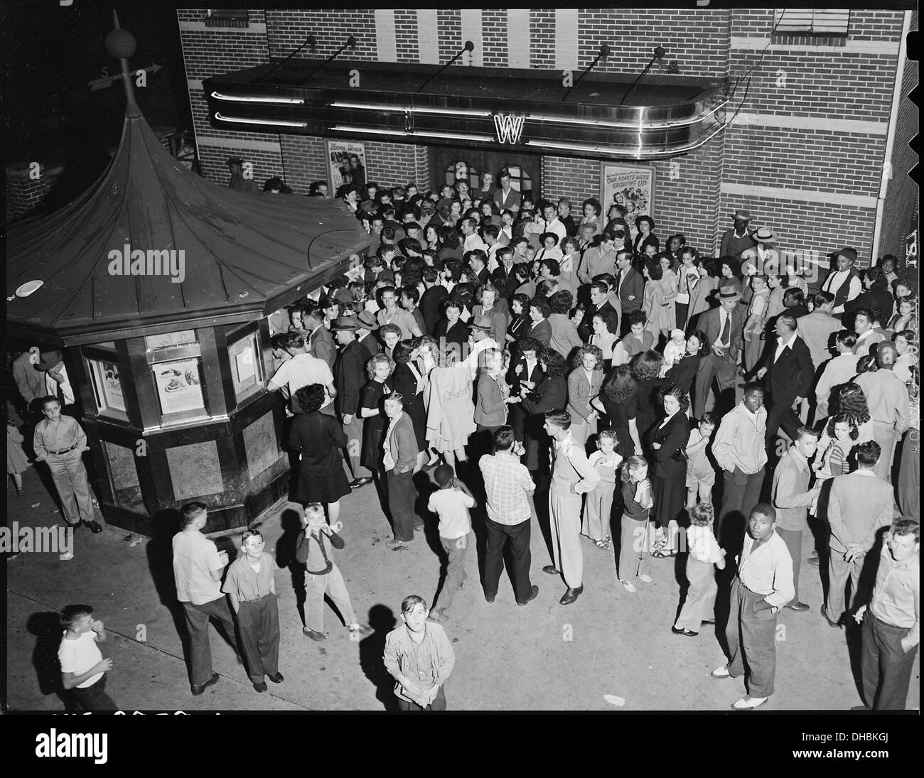 Crowd waiting to attend movie showing on Saturday night. Inland Steel Company, Wheelwright 5E1 & 2 Mines, Wheelwright... 541429 Stock Photo