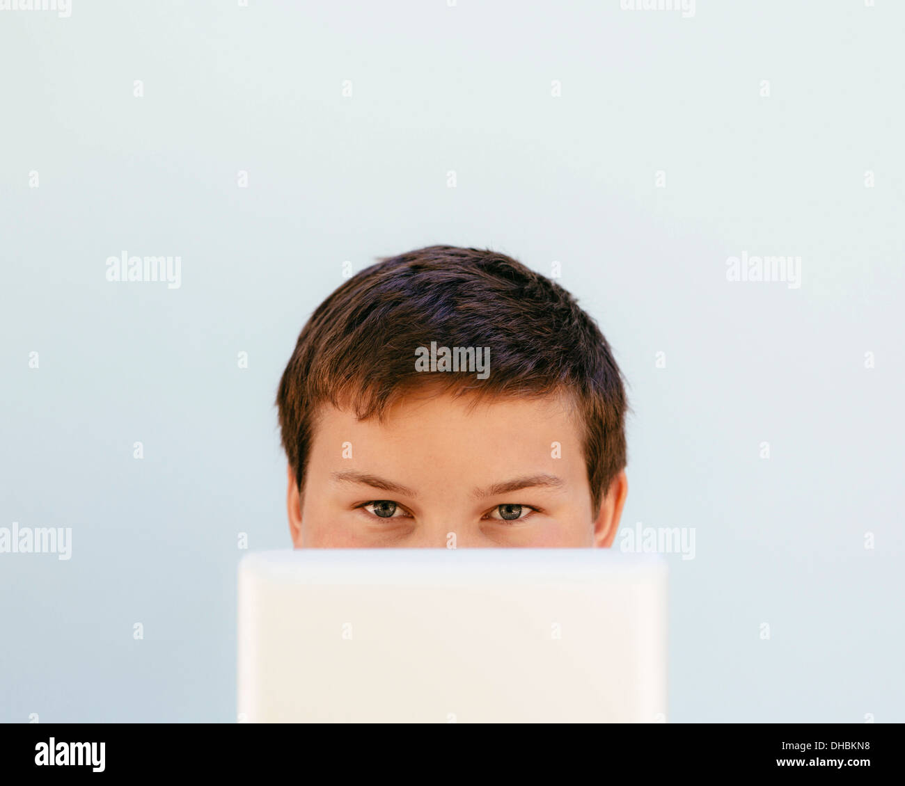 Portrait of a teenage boy using a digital tablet. Stock Photo