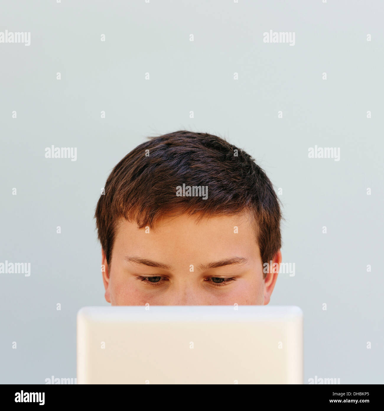 Portrait of a teenage boy using a digital tablet. Stock Photo