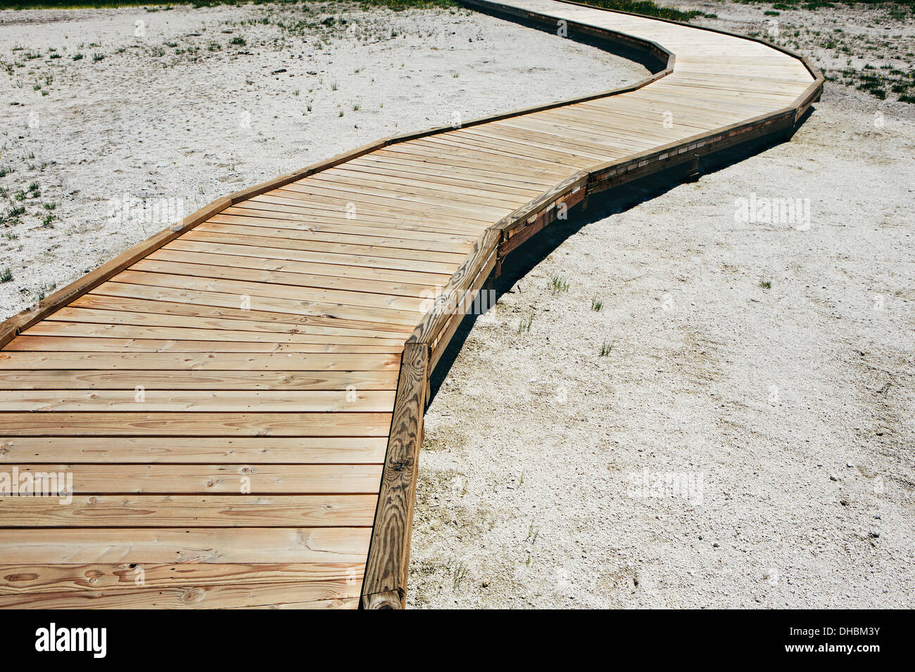 A boardwalk extending across Midway Geyser in Yellowstone National Park. Stock Photo