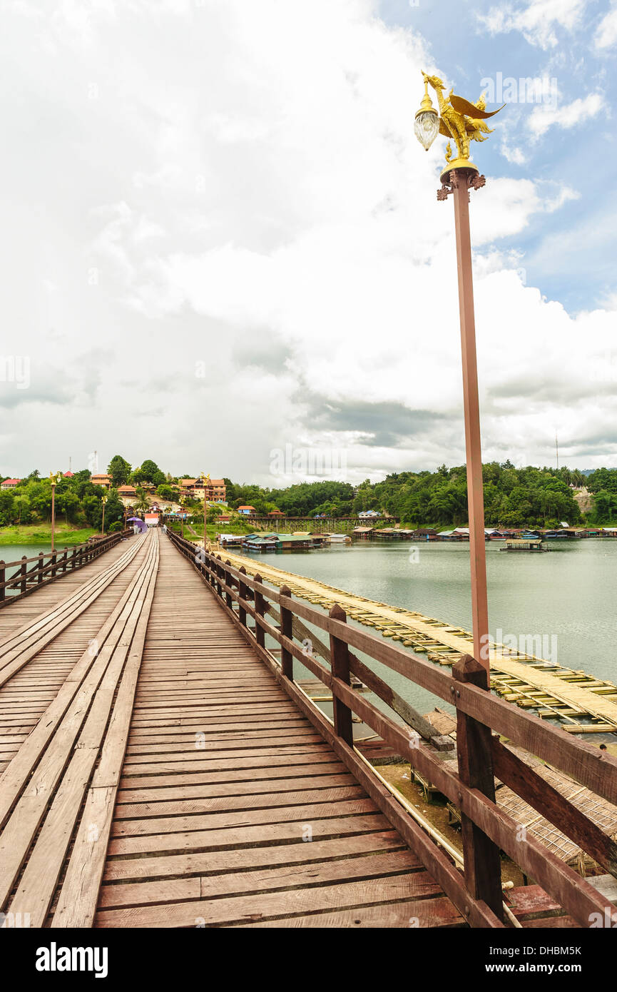 Traditional long wooden Mon Bridge connecting the main part of Songkhla Buri with the Mon village. Stock Photo