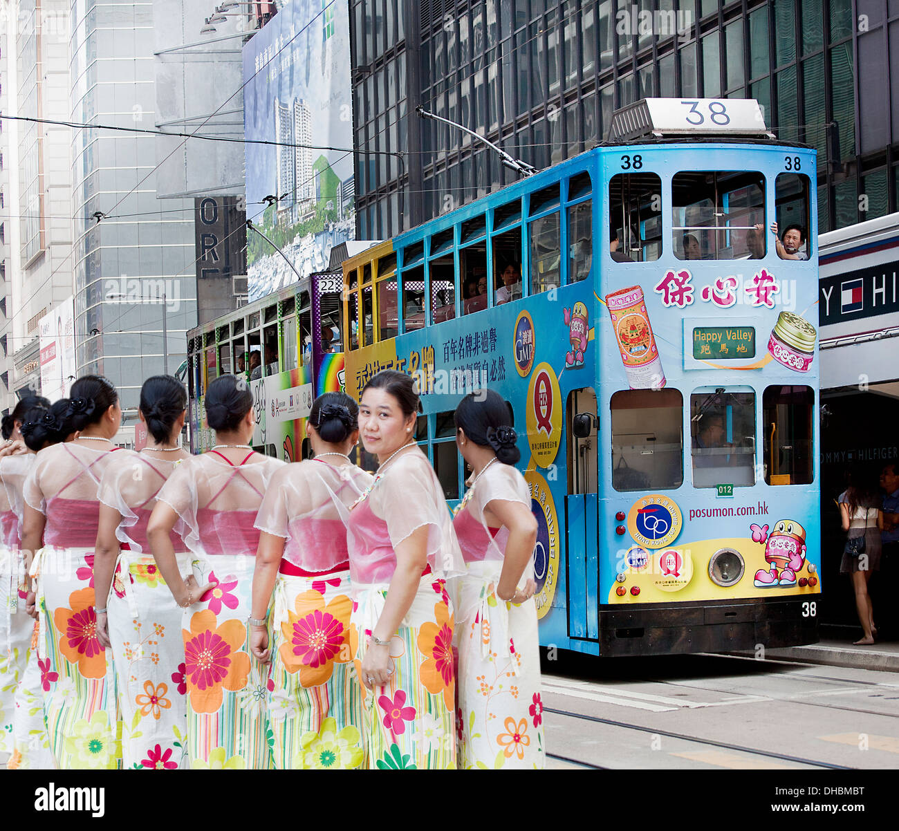 A color photograph of a group of local Chinese woman in ceremonial dress in Hong Kong Stock Photo