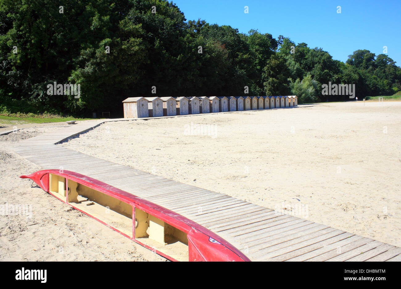 beach huts and canoe on beach at Baie de la Somme, Quai Jeanne d'Arc