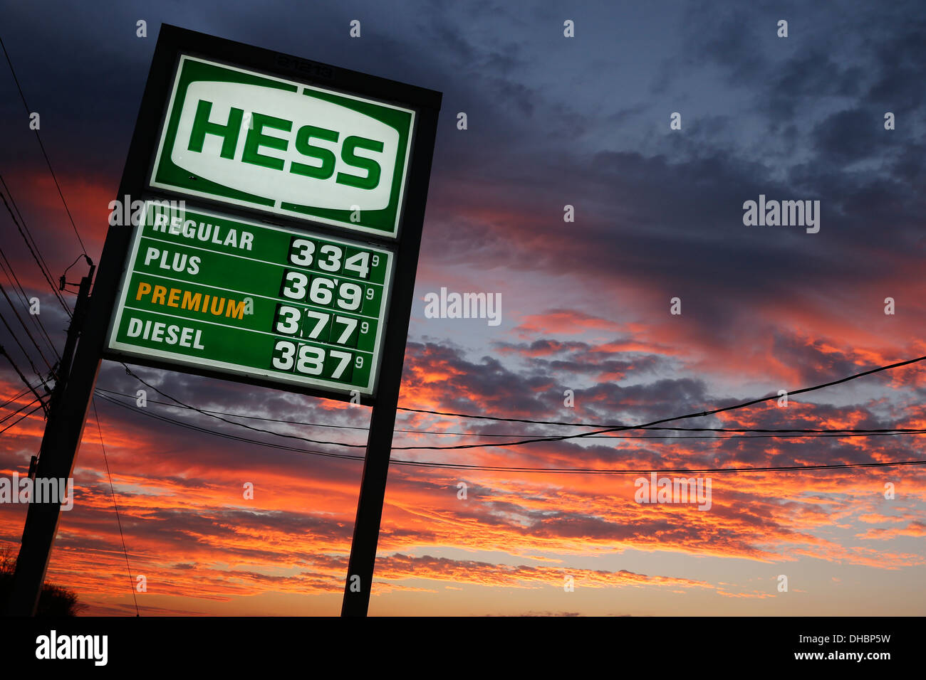 Gasoline station sign with prices sunset Stock Photo