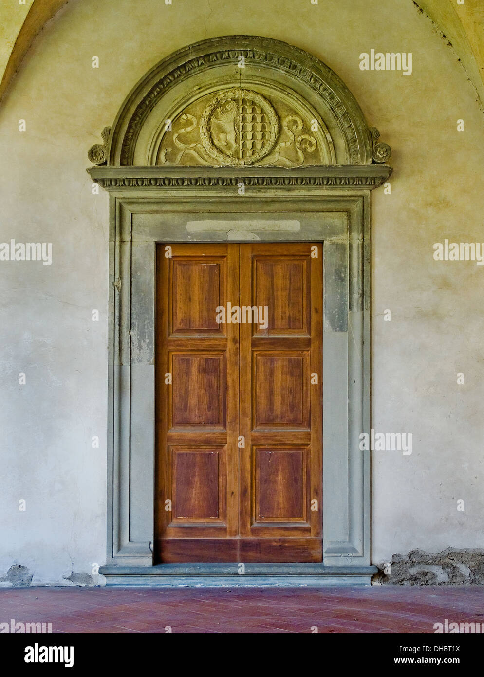 Renaissance door in the gallery of cloister of Basilica di Santa Croce. Florence, Italy Stock Photo