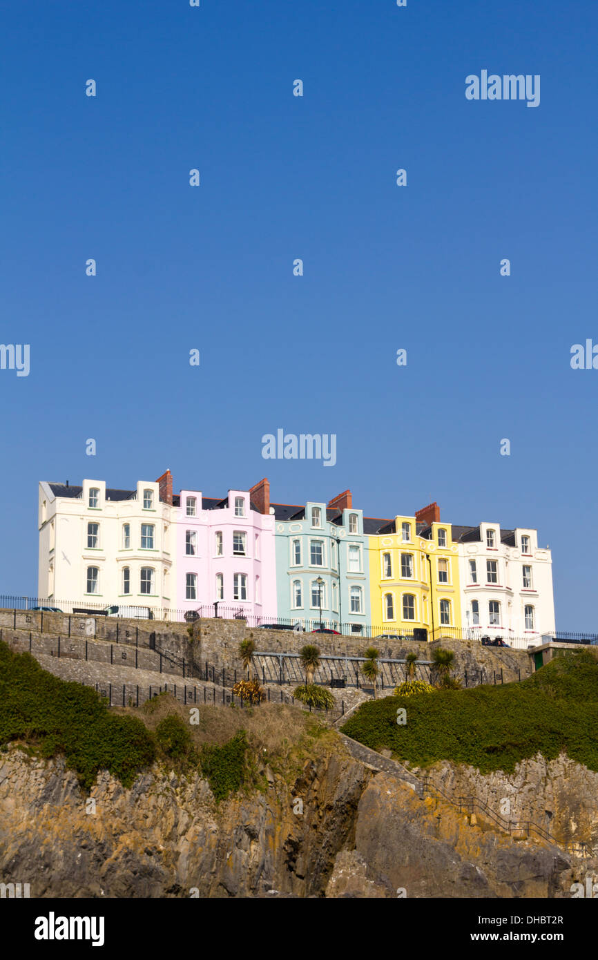 Pastel coloured hotel frontages in a terraced row on the Esplanade at Tenby, Pembrokeshire, Wales, UK Stock Photo