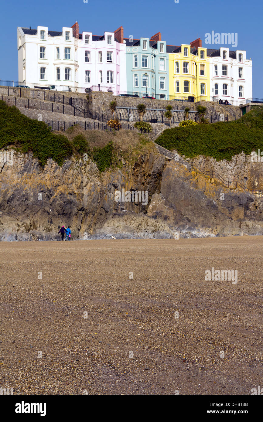 Pastel coloured hotel frontages in a terraced row on the Esplanade at Tenby, Pembrokeshire, Wales, UK Stock Photo