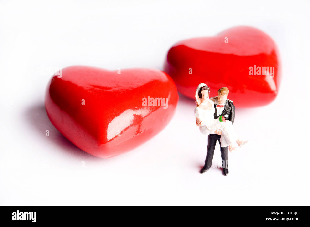bride and groom figurines with hearts Stock Photo