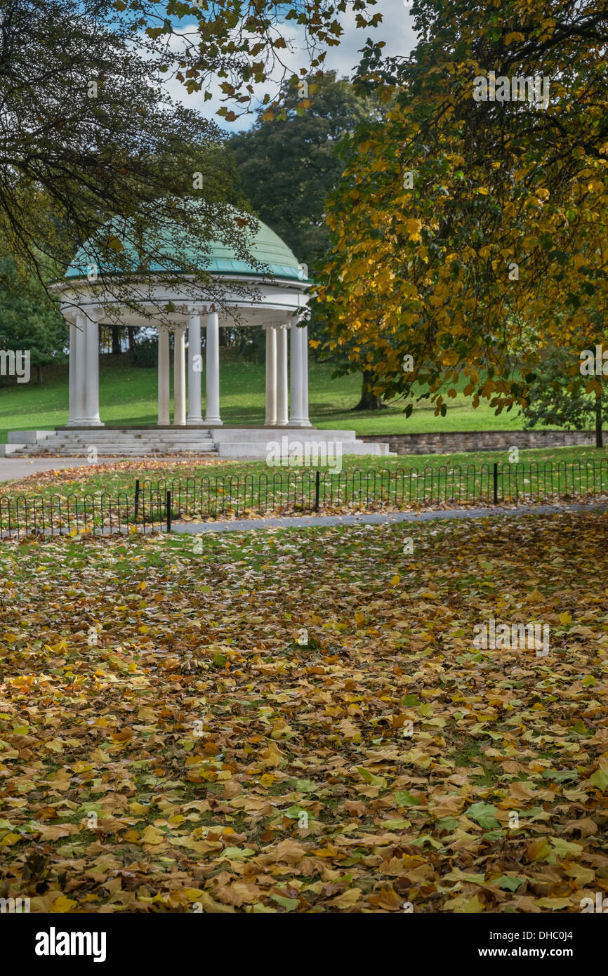 Traditional bandstand in English park with autumn leaves Stock Photo