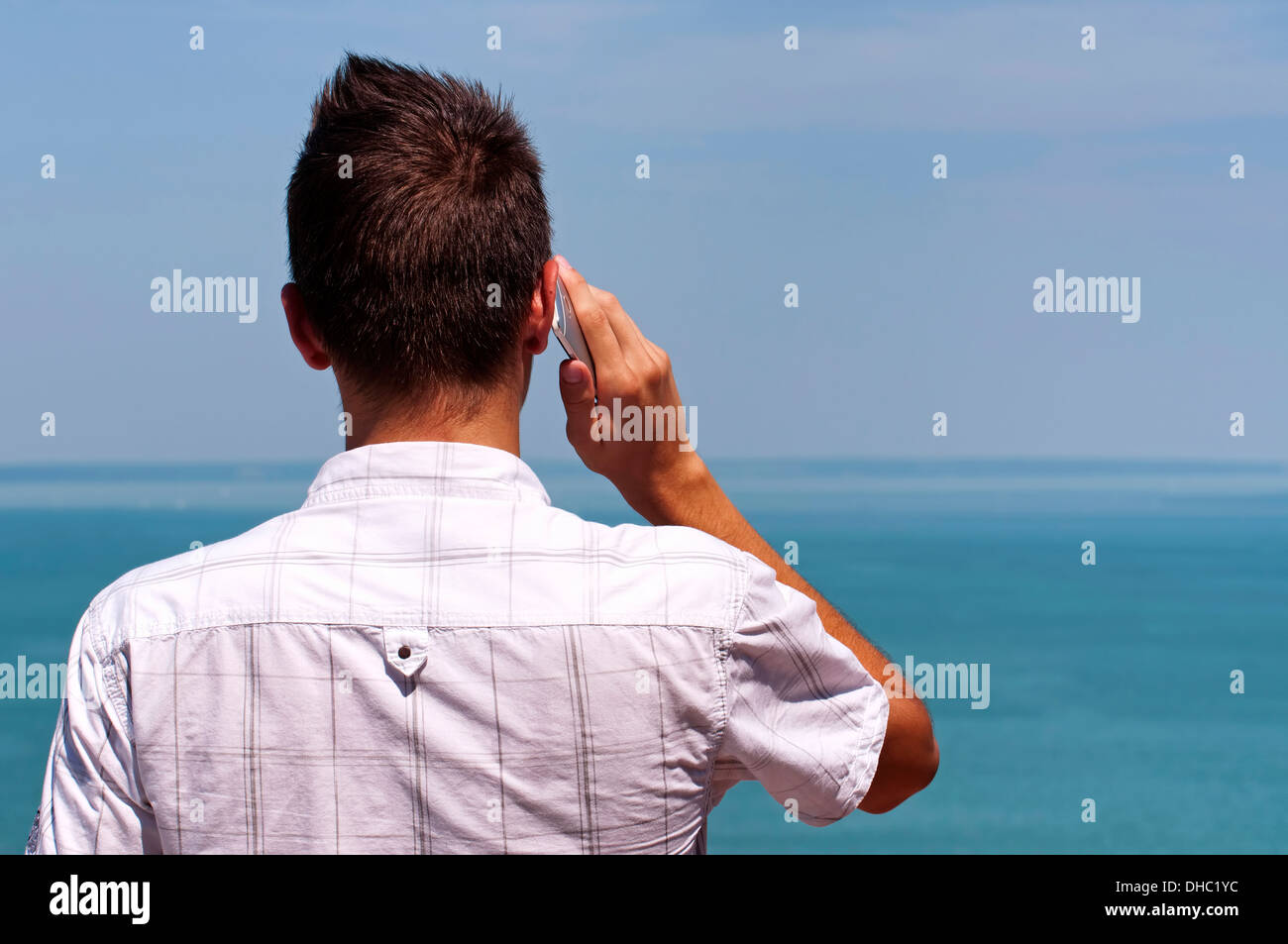 Teenager boy calling by cellular phone Stock Photo