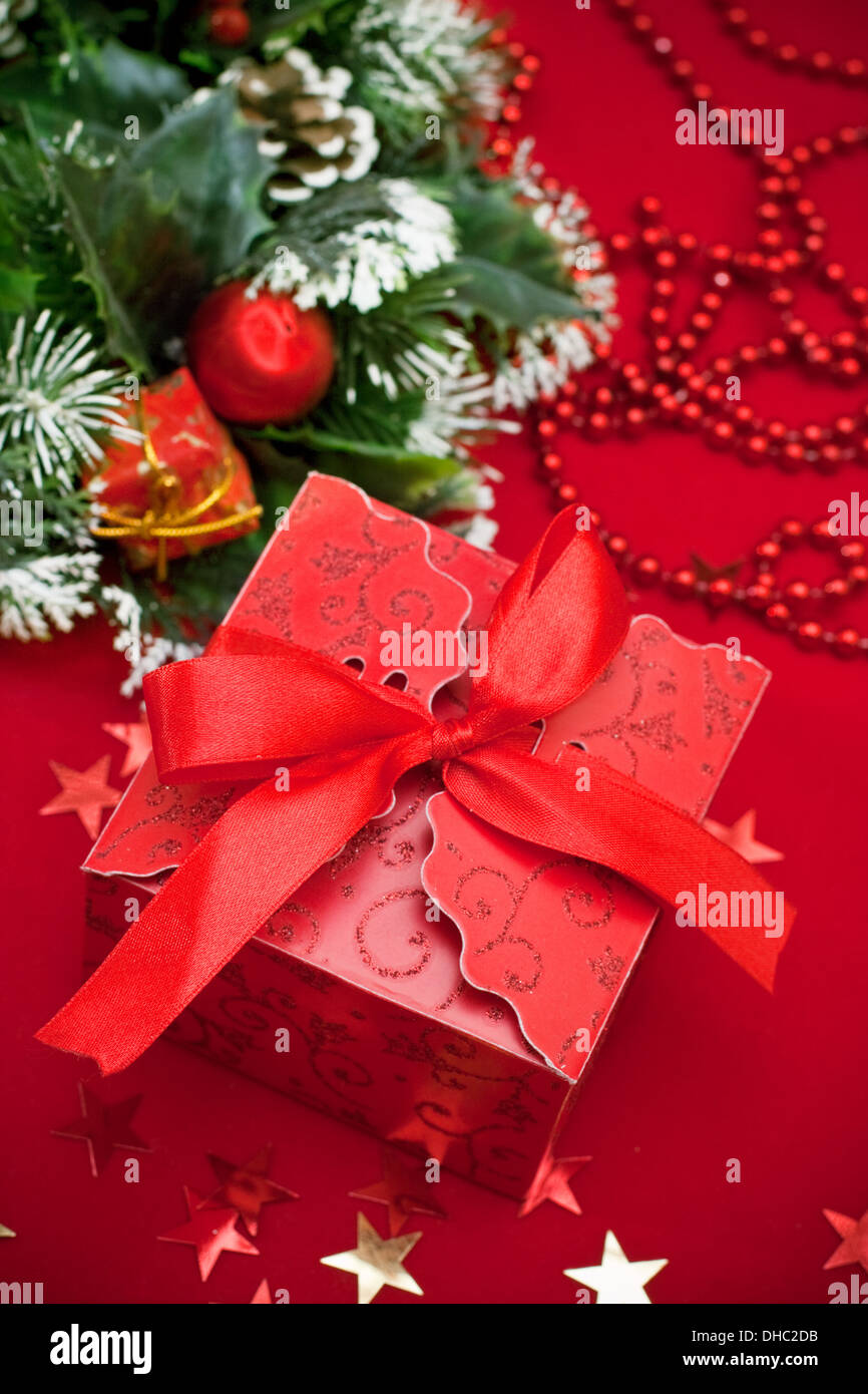 Christmas gift box on red background Stock Photo - Alamy