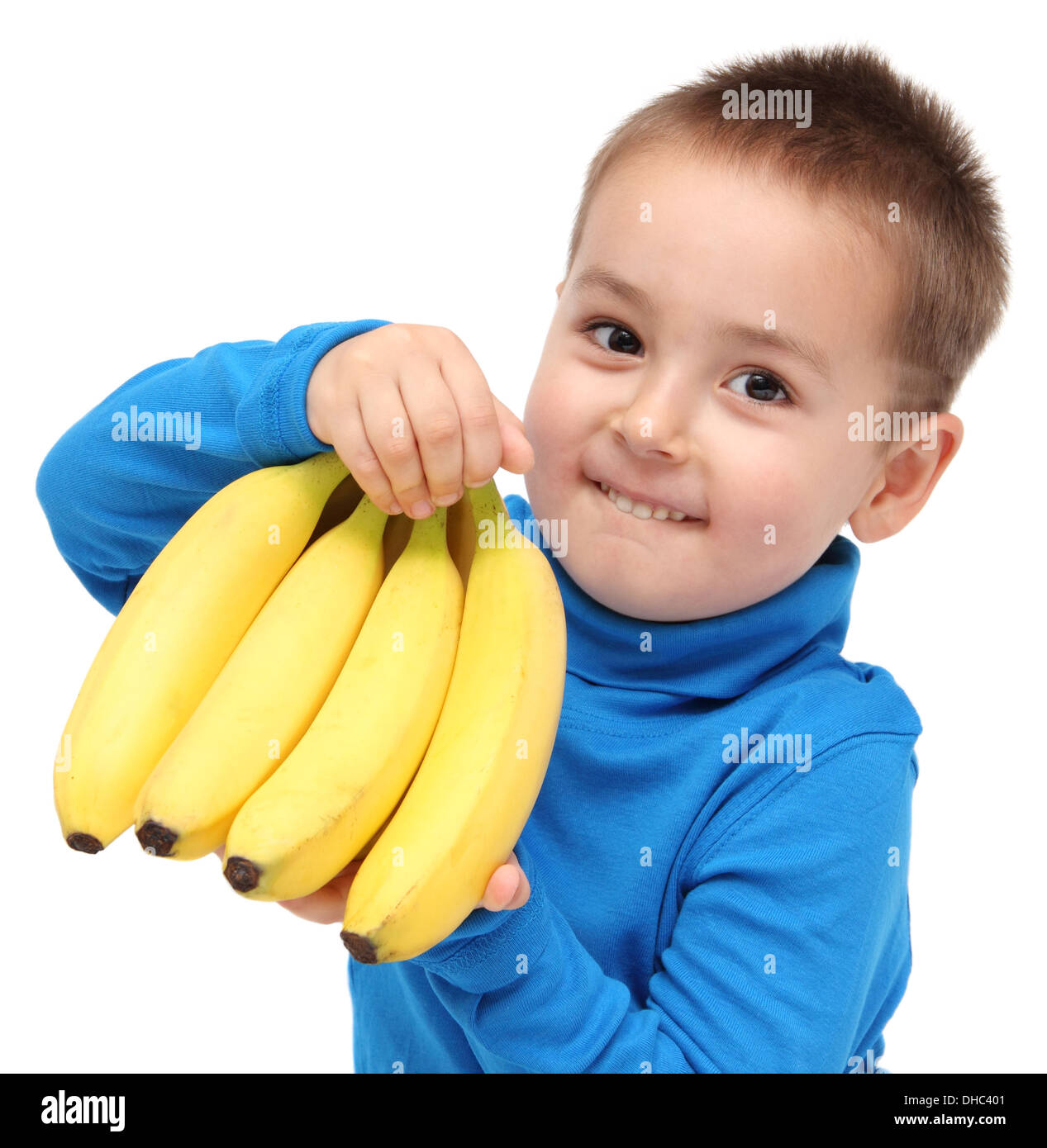 little boy holds bananas Stock Photo