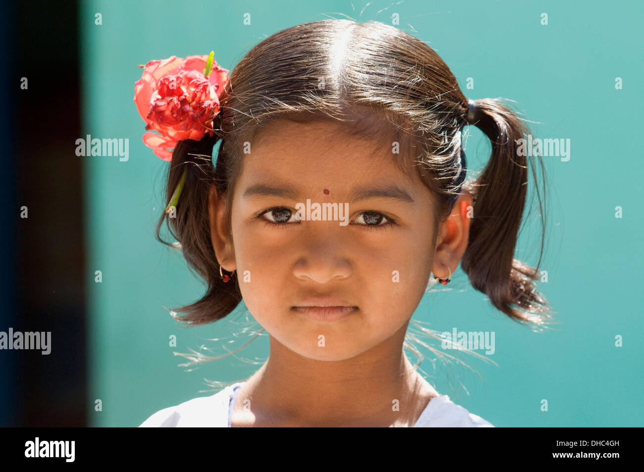 Young South Indian girl child with flowers in her hair stood in front of her family home in Puttaparthi South India Stock Photo - Alamy Young South Indian girl child with flowers in her hair stood in front of her family home in Puttaparthi South India Stock Photo - Alamy