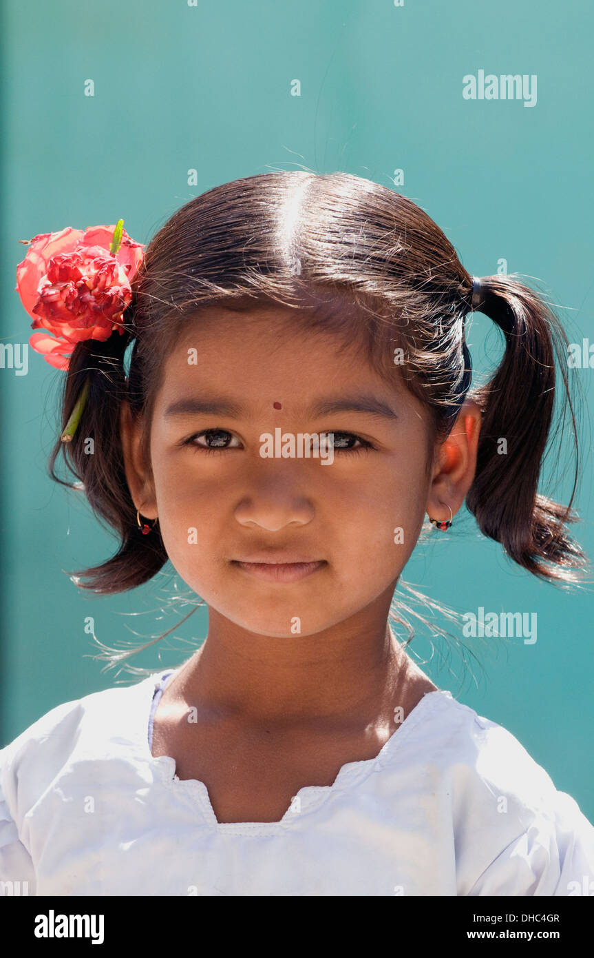 Young South Indian girl child with flowers in her hair stood in front of her family home in Puttaparthi South India Stock Photo - Alamy Young South Indian girl child with flowers in her hair stood in front of her family home in Puttaparthi South India Stock Photo - Alamy