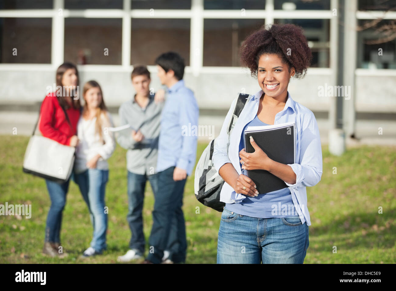 Female Student Holding Books On College Campus Stock Photo - Alamy