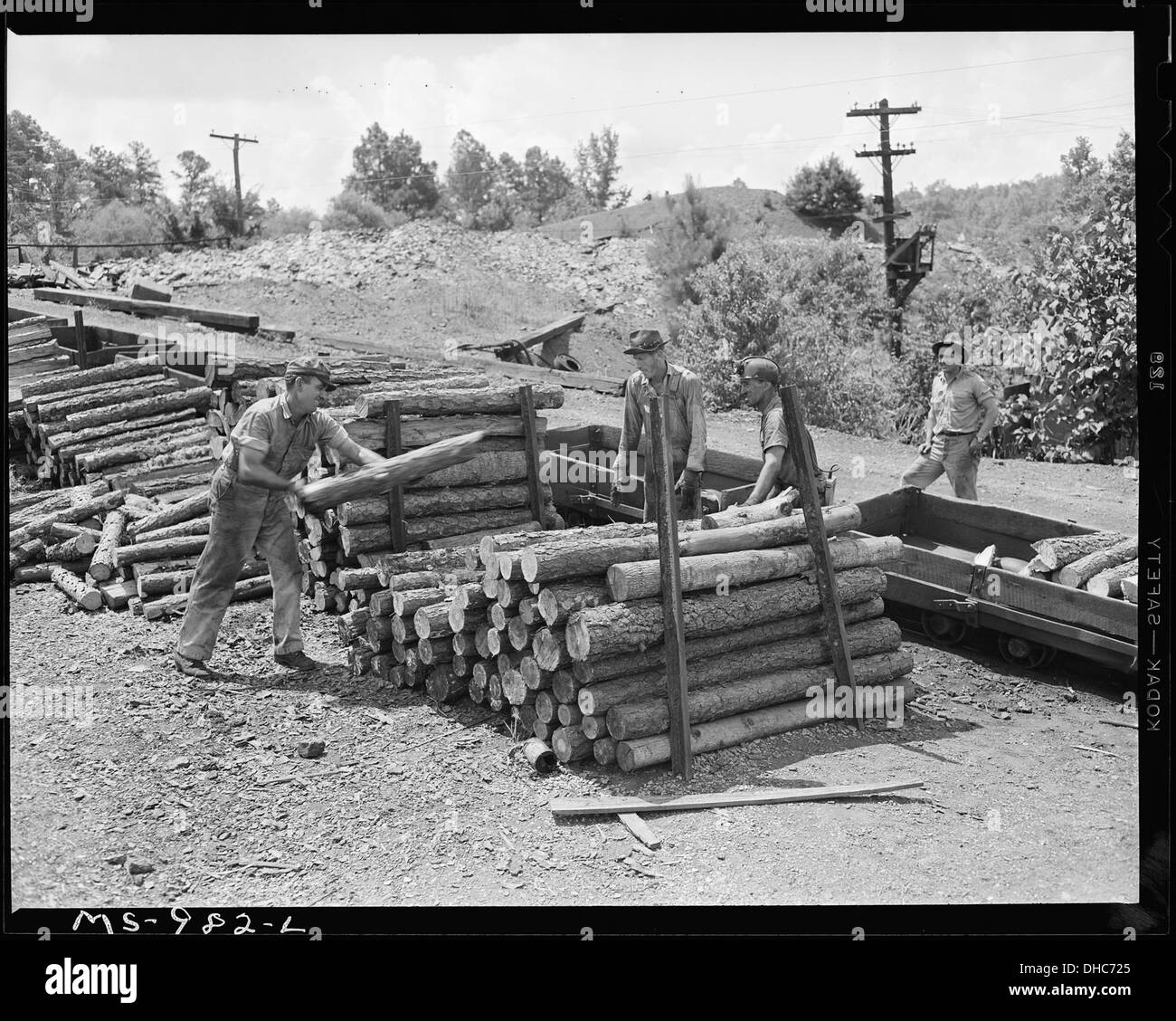Miners loading mine props into shuttle cars. Brilliant Coal Company