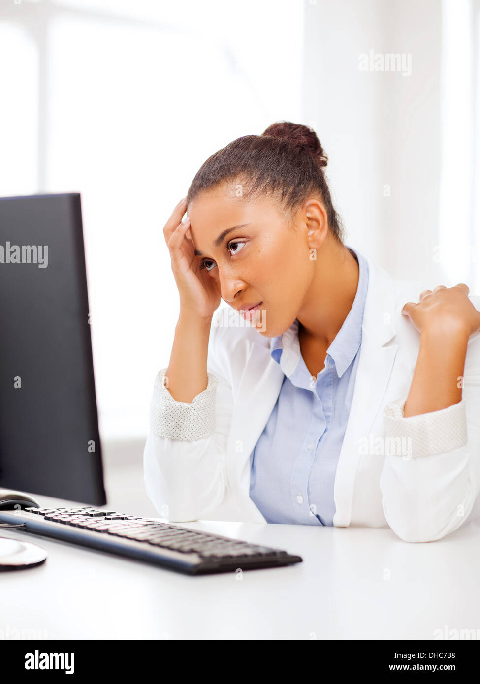 stressed african woman with computer Stock Photo - Alamy