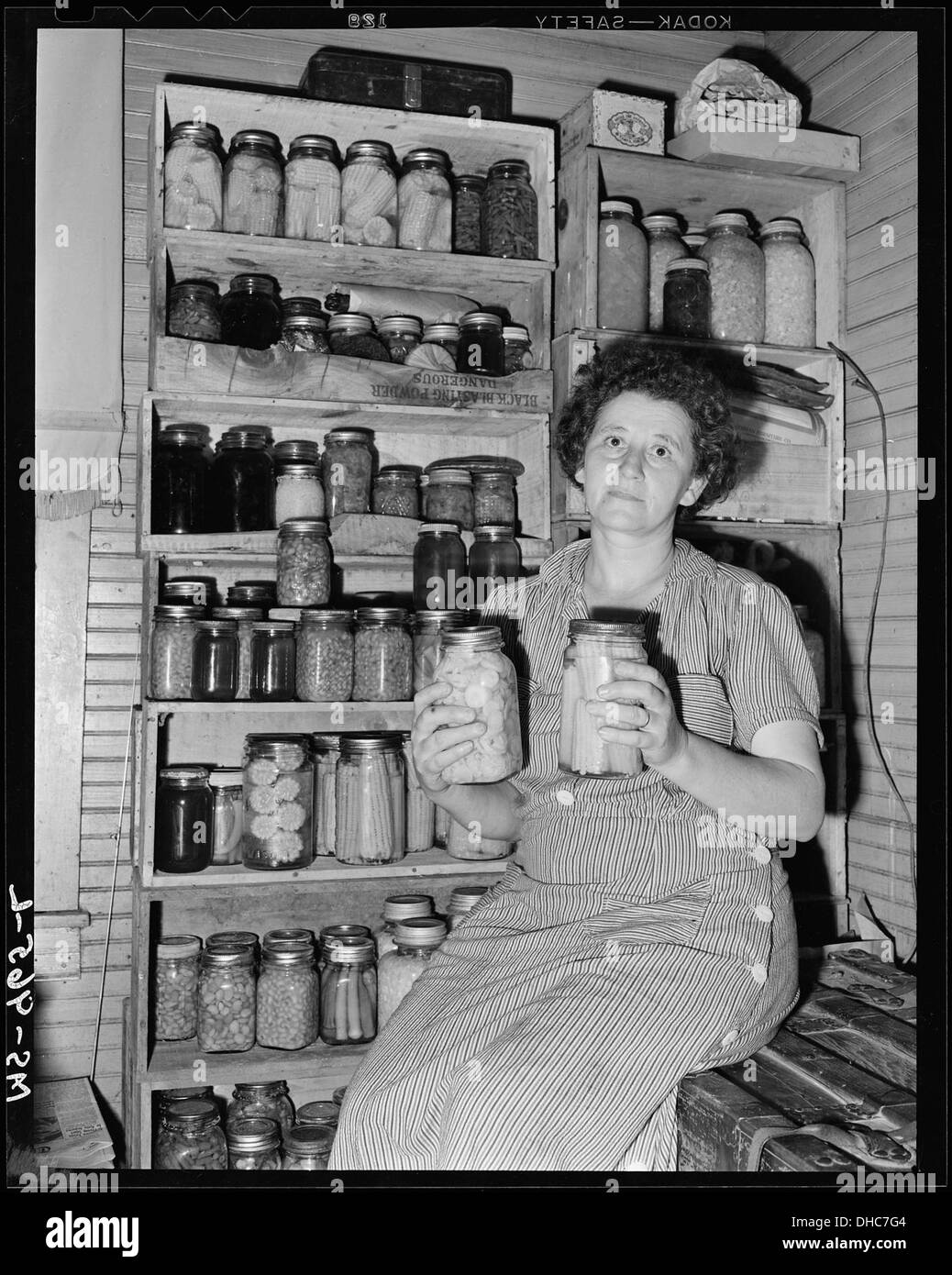 Mrs. Mack Brasseak, wife of miner, with some of the vegetables she has canned. Consolidated Coal Company, Bankhead... 540634 Stock Photo