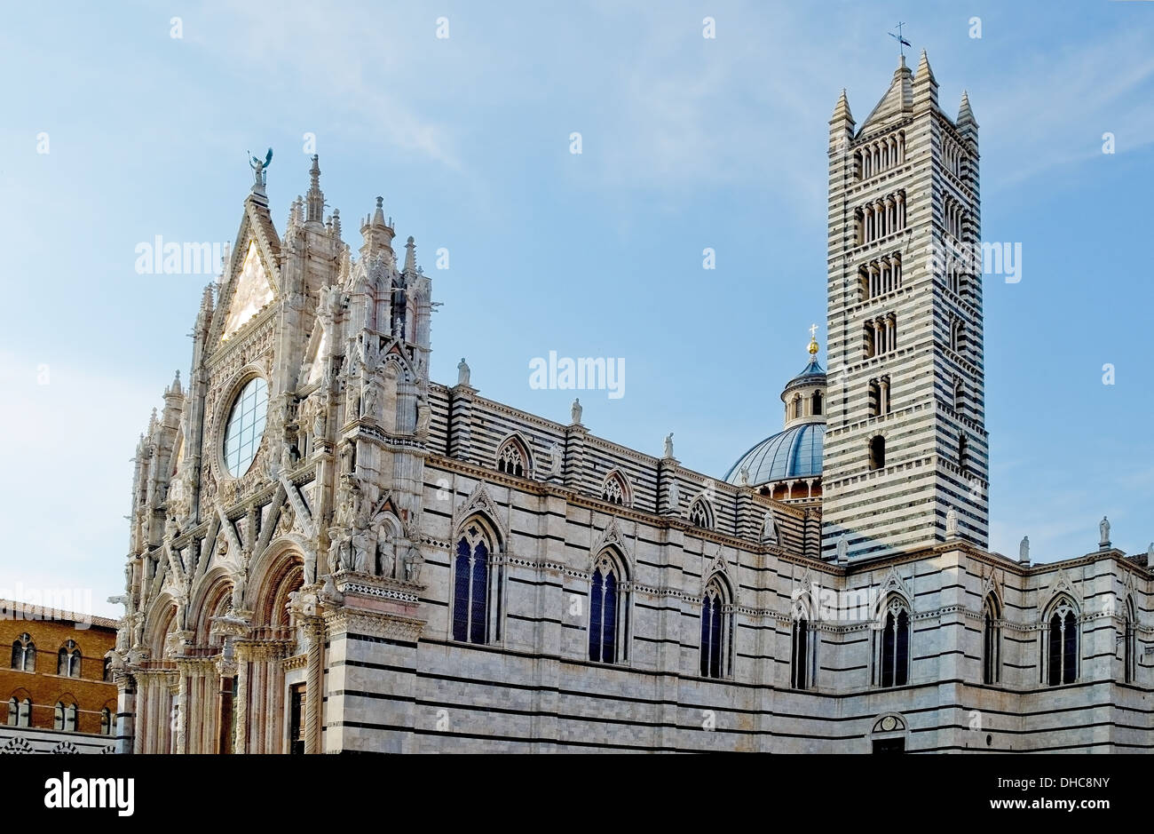 The facade and belfry of the Siena Cathedral in Opera della metropolitana. Siena, Italy Stock Photo