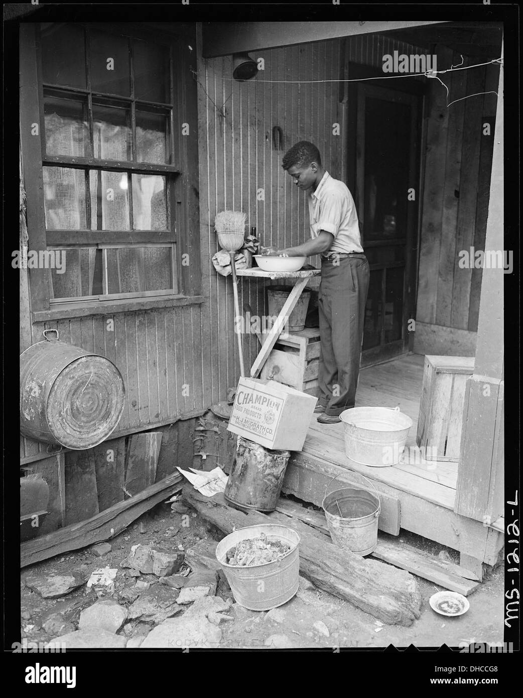 Son of Lonnie Davis, miner, washing hands. Water is carried from outside tap. Kingston Pocahontas Coal Company... 540731 Stock Photo
