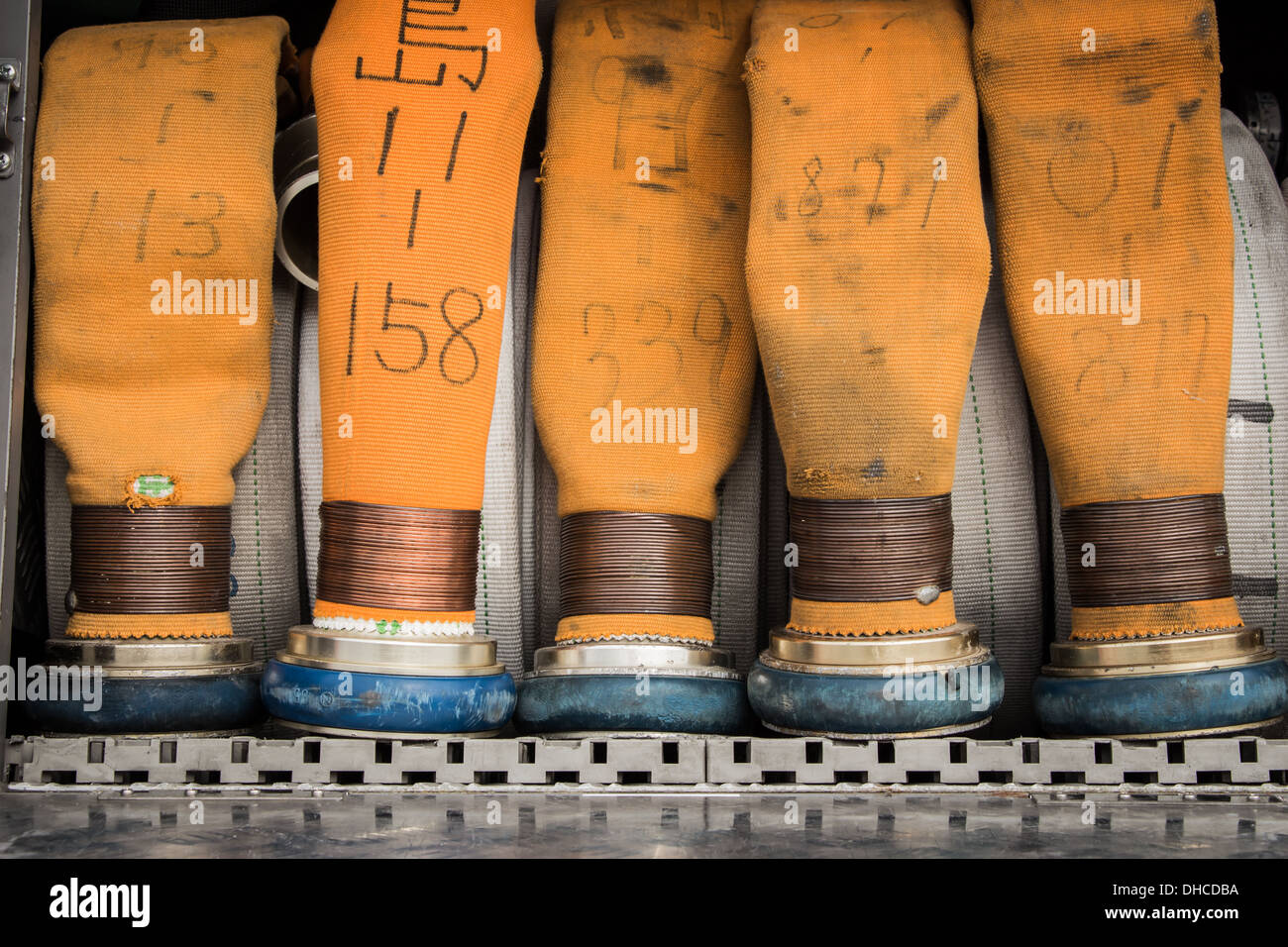 Yellow fire hoses on a fire truck Stock Photo Alamy