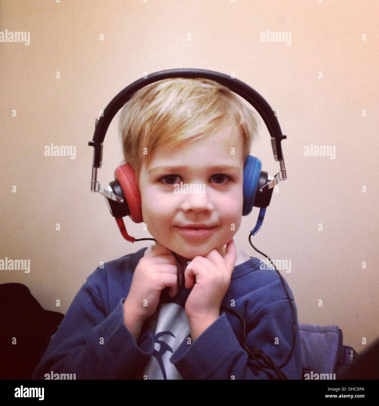 Young Boy Wearing Headphones Stock Photo