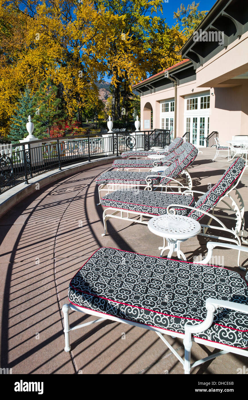 Chaise lounge chairs on patio, The Broodmoor, historic luxury hotel and resort, Colorado Springs, Colorado, USA Stock Photo