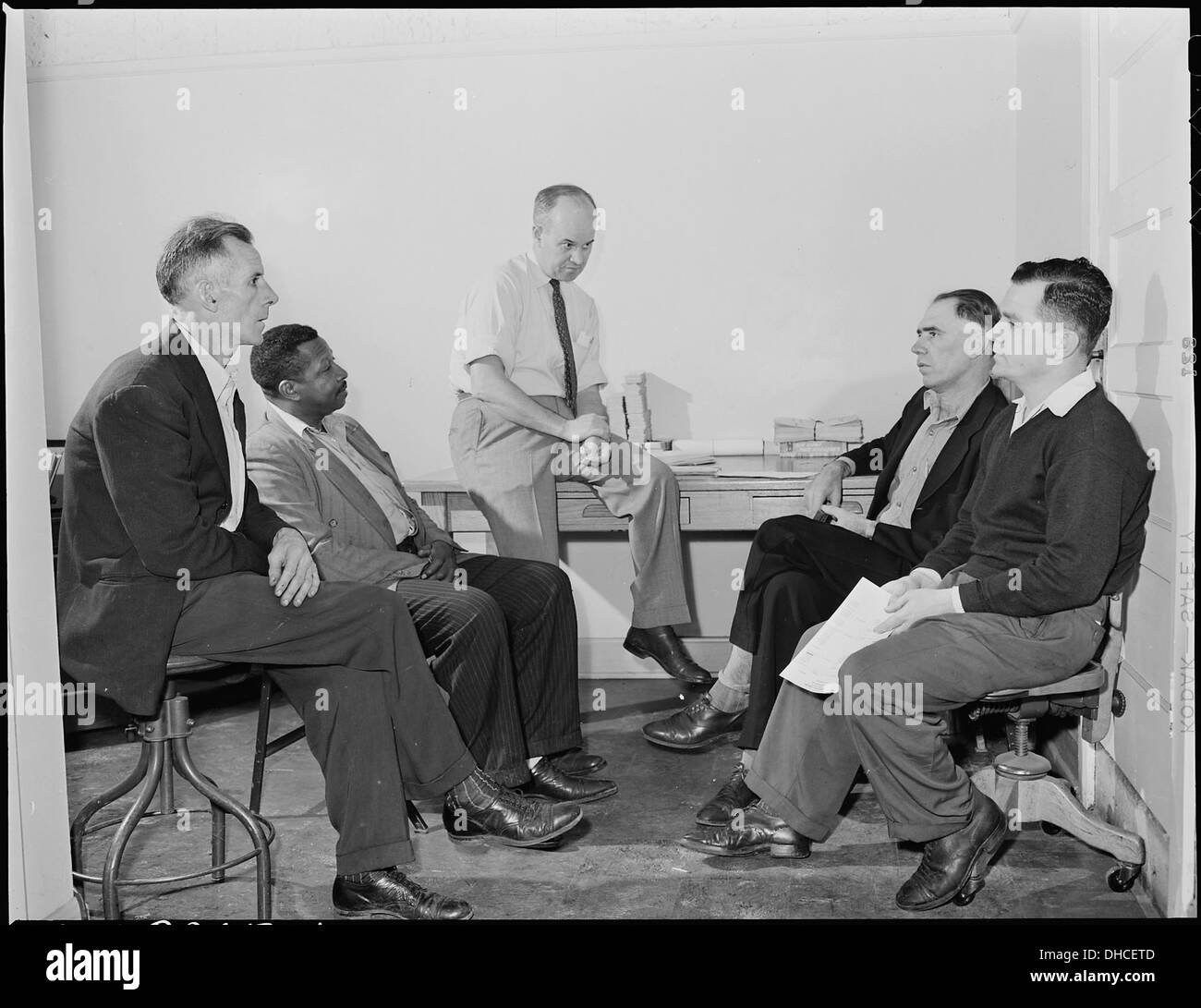 Wheelwright Employee's Association meeting from left to right are, Roy Thomas, Will Simmons, C. R. Miller, Treasurer... 541488 Stock Photo