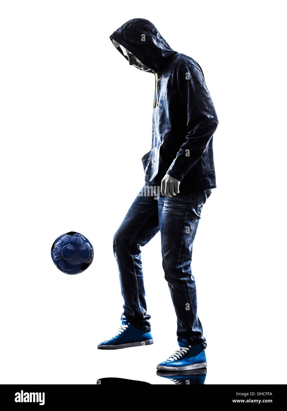 one young man soccer freestyler player in silhouette on white