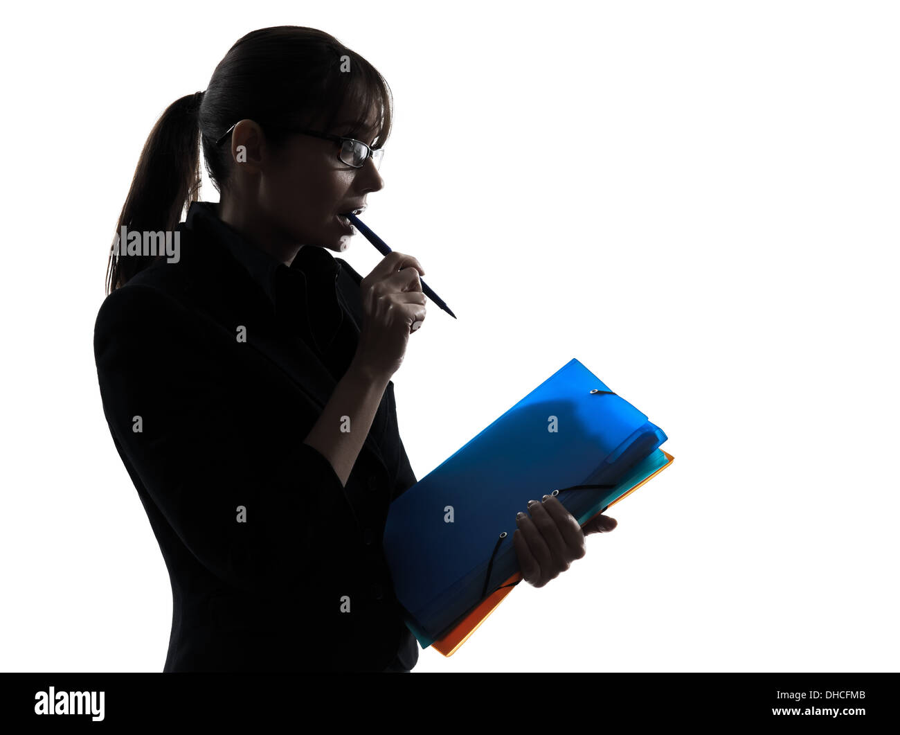 one business woman focused holding folders files silhouette studio isolated on white background Stock Photo