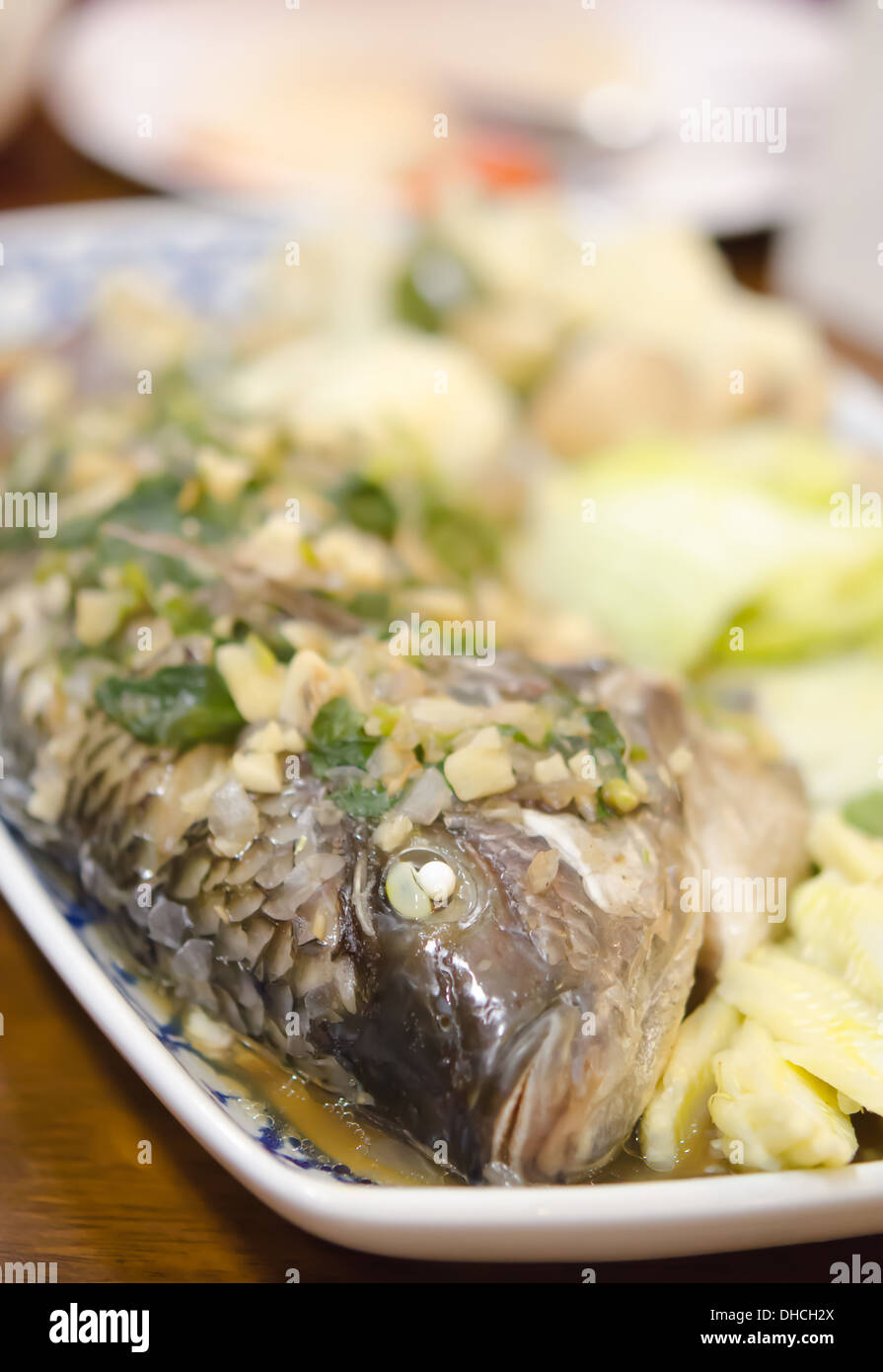 steamed fish with garlic , herbs and vegetable Stock Photo Alamy