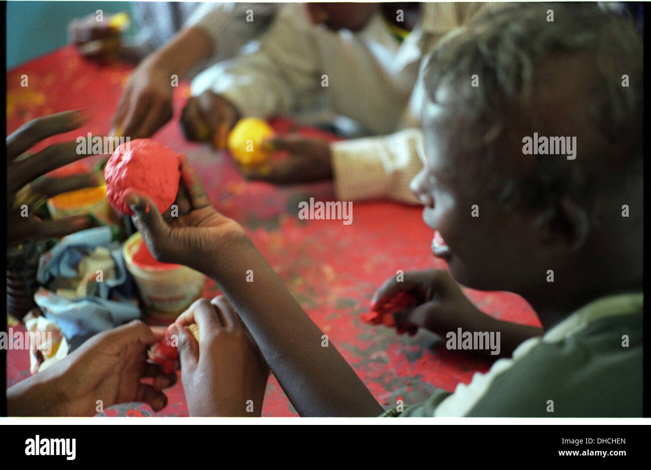 ipjr09441219September 2004 Athbarah Nahr An Nil SudanStudents painting paper mache ball in primary colours.. Broader Horizons Stock Photo