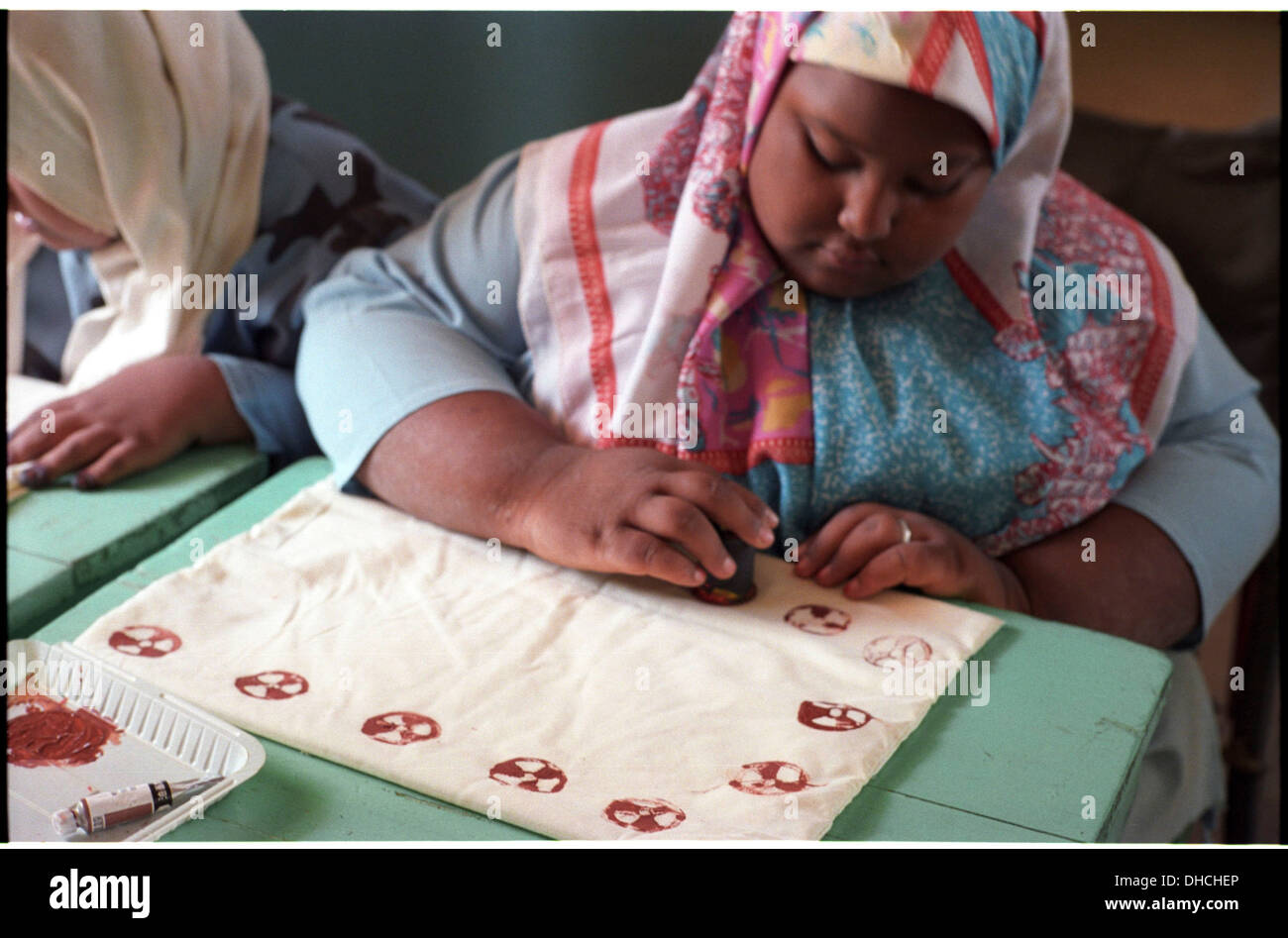 ipjr09441222September 2004 Athbarah Nahr An Nil SudanA girl making printed pillow cases.. Broader Horizons Institute for Stock Photo