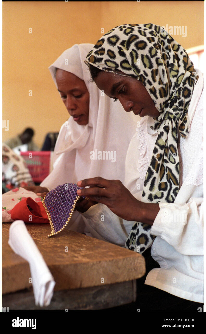 ipjr09441235September 2004 Athbarah Nahr An Nil SudanBeading for the community, students make mats and decorative items that Stock Photo