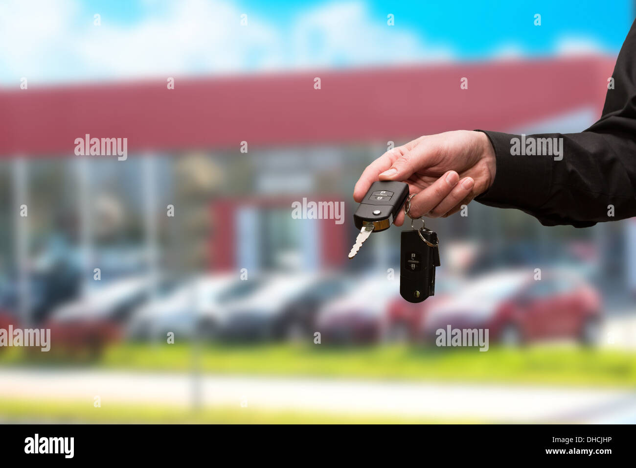car loan rental auto key dealer dealership new sales control repair business black handing mechanic background automotive igniti Stock Photo