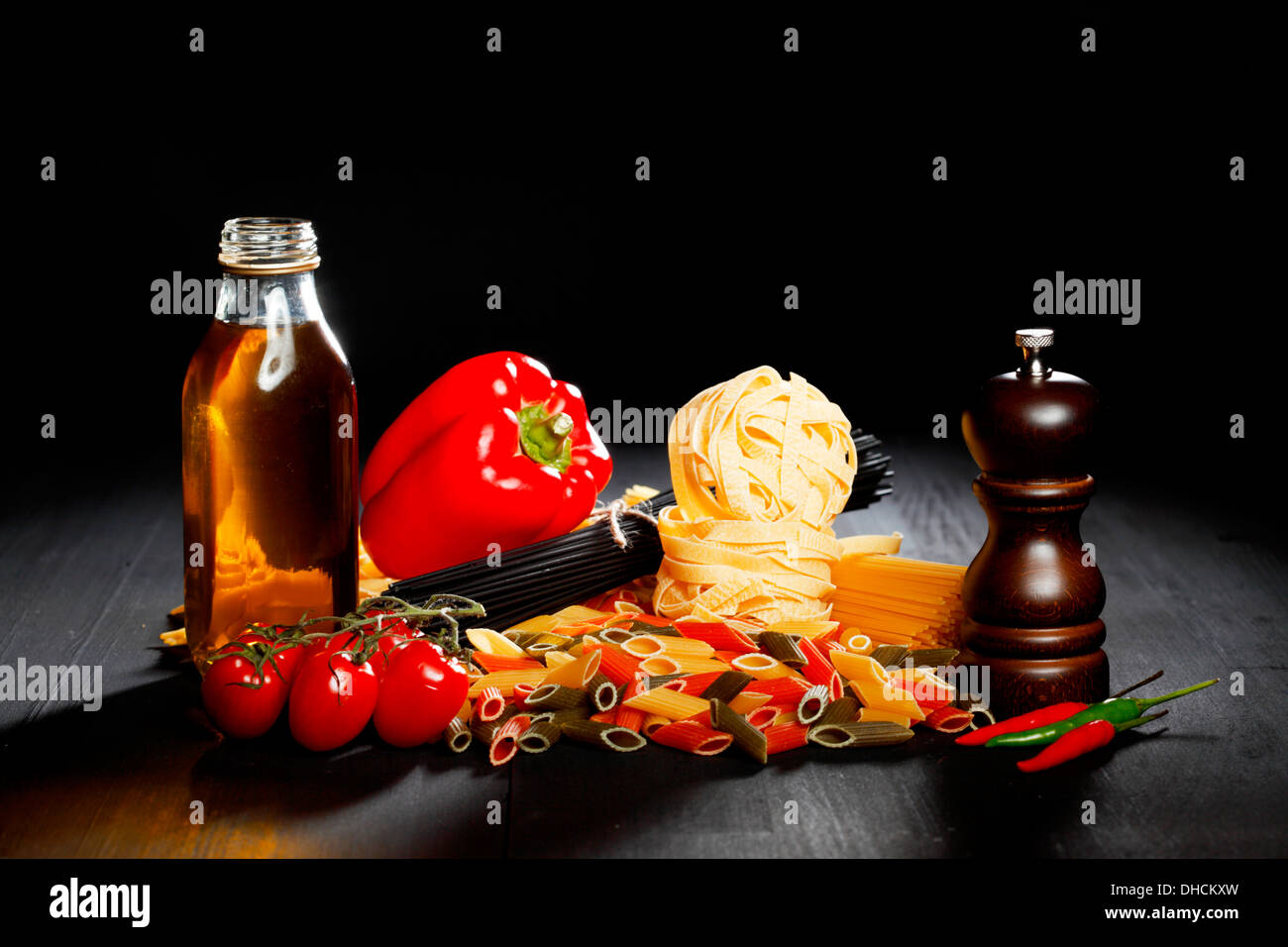 Pasta ingredients on black table, italian cuisine concept Stock Photo