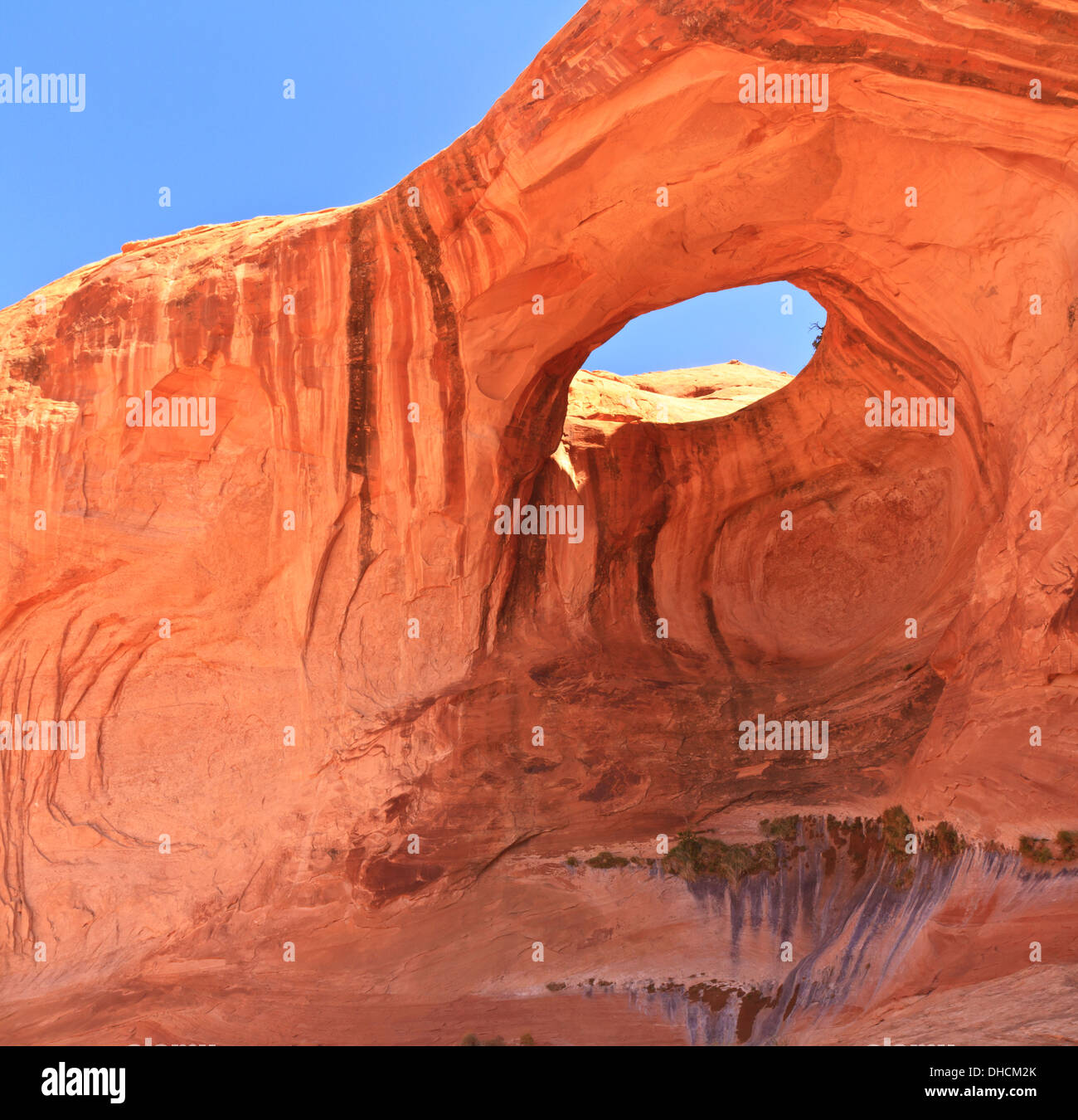 Bow Tie Arch, a natural "pothole arch" eroded in the red rock near Moab, Utah Stock Photo