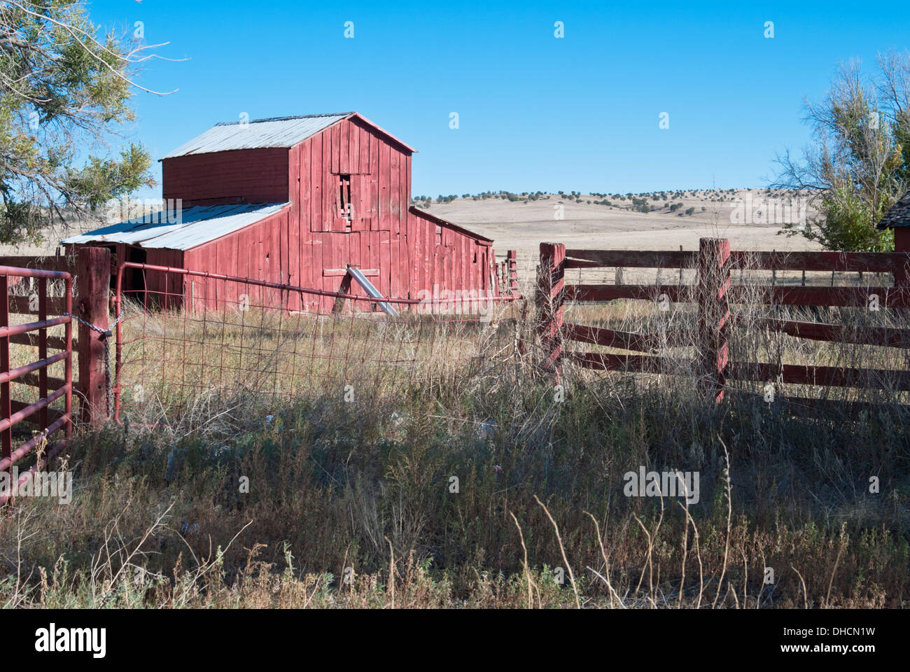 A red barn adds color to a side street in Capitan, New Mexico. Stock Photo