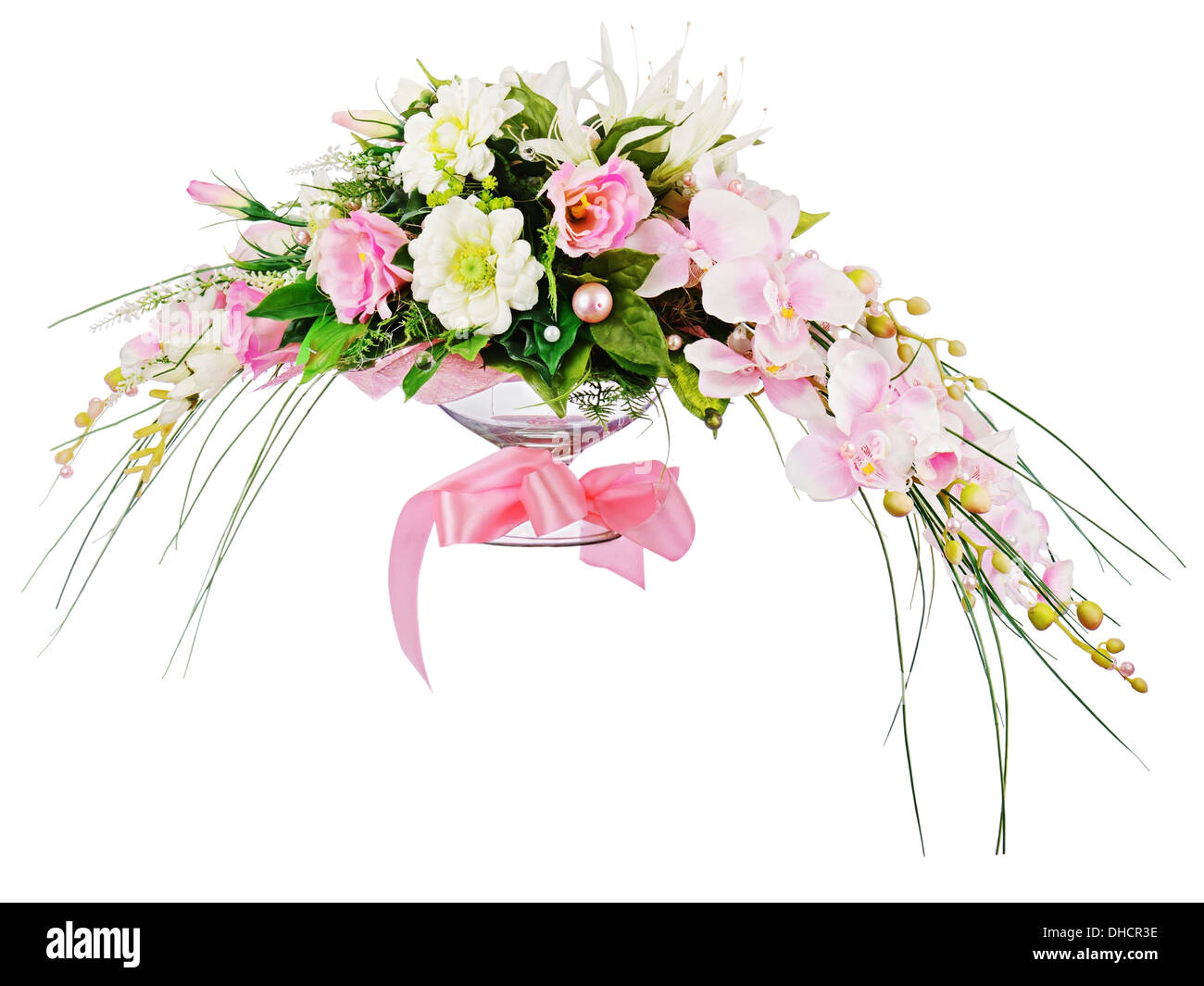 Floral bouquet of roses and orchids arrangement centerpiece isolated on white background. Closeup. Stock Photo