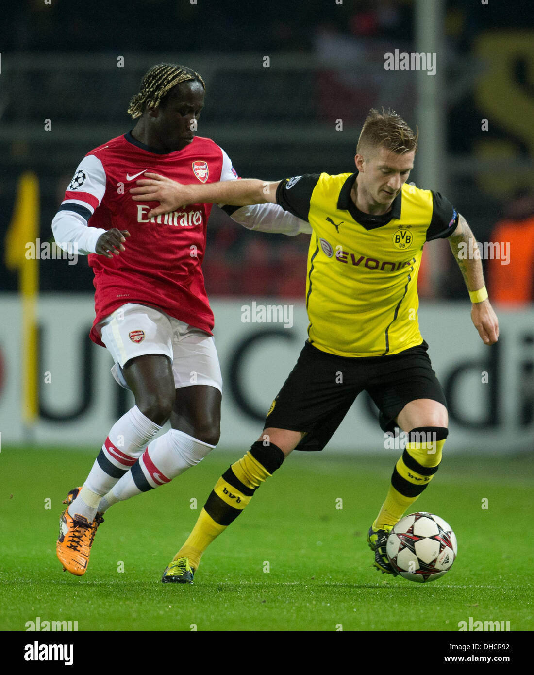 Dortmund, Germany. 06th Nov, 2013. Dortmund's Marco Reus (R) in action against Arsenal's Bacary Sagna during the Champions League Group F match between Borussia Dortmund and FC Arsenal London at BVB-Stadion in Dortmund, Germany, 06 November 2013. Photo: Bernd Thissen/dpa/Alamy Live News Stock Photo