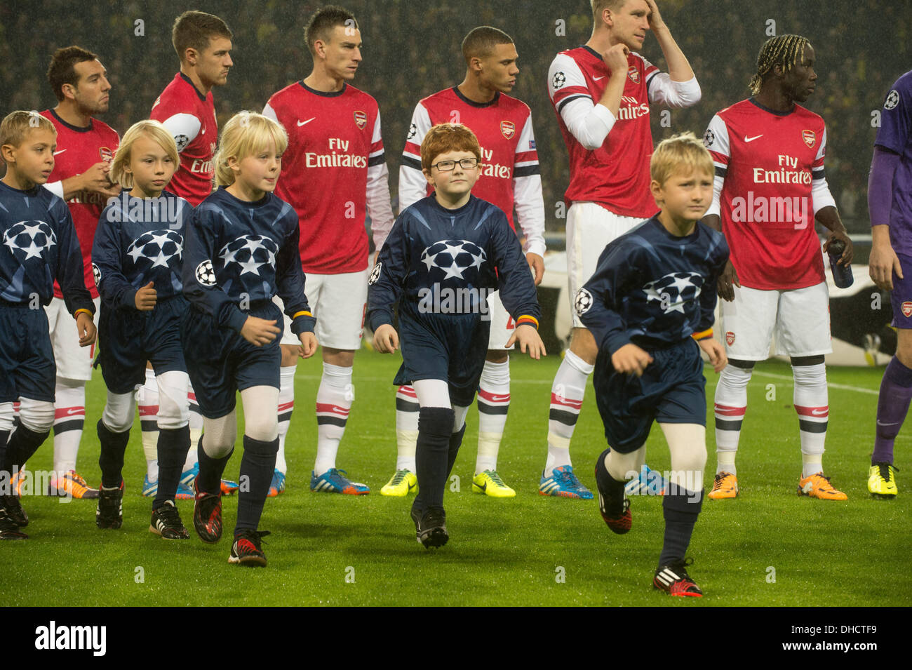 Dortmund, Germany. 06th Nov, 2013. Arsenal's players and escort kids enter  the pitch before the Champions League Group F match between Borussia  Dortmund and FC Arsenal London at BVB-Stadion in Dortmund, Germany,
