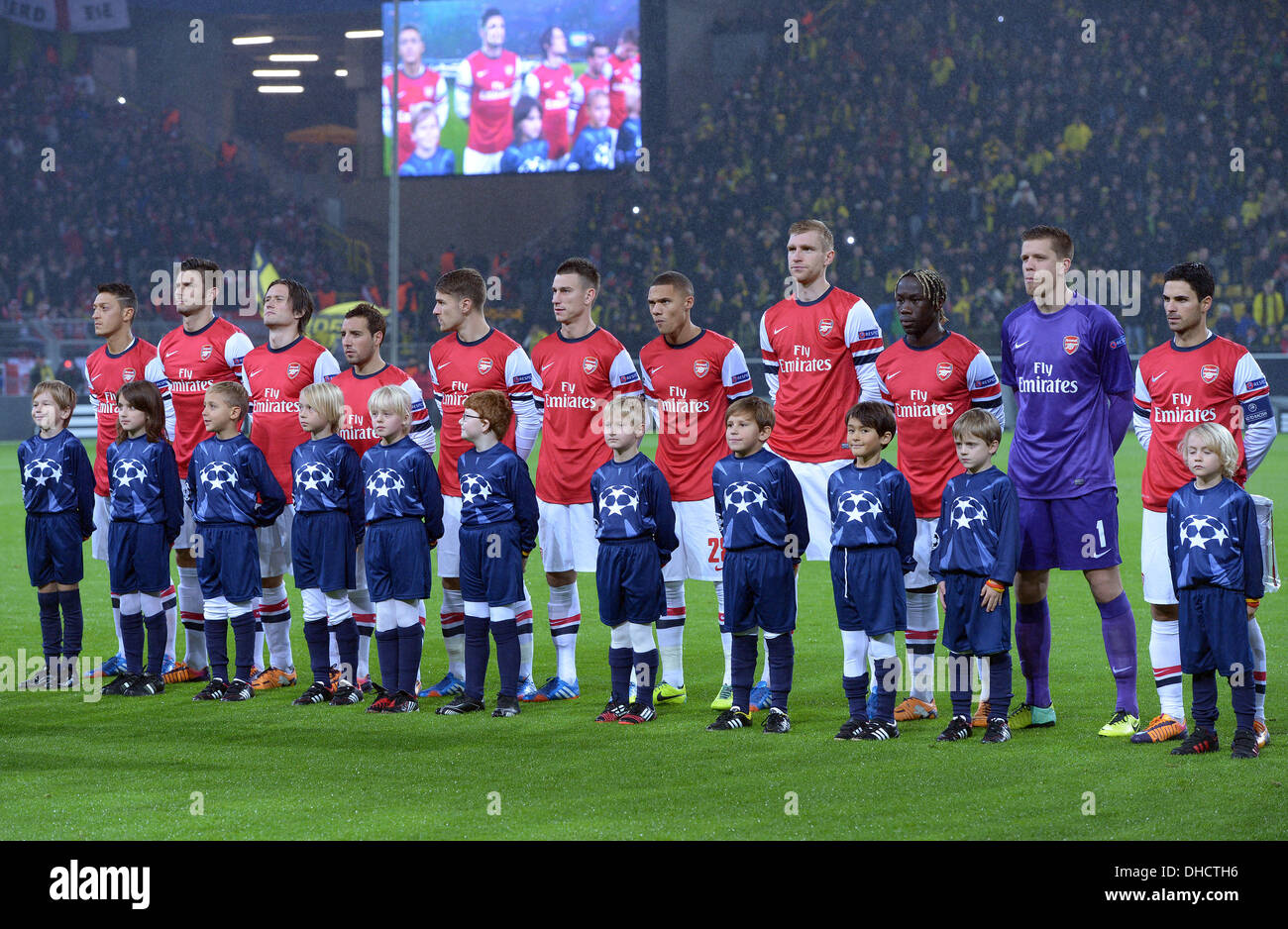 Dortmund, Germany. 06th Nov, 2013. Arsenal's players and escort kids on the  pitch before the Champions League Group F match between Borussia Dortmund  and FC Arsenal London at BVB-Stadion in Dortmund, Germany,