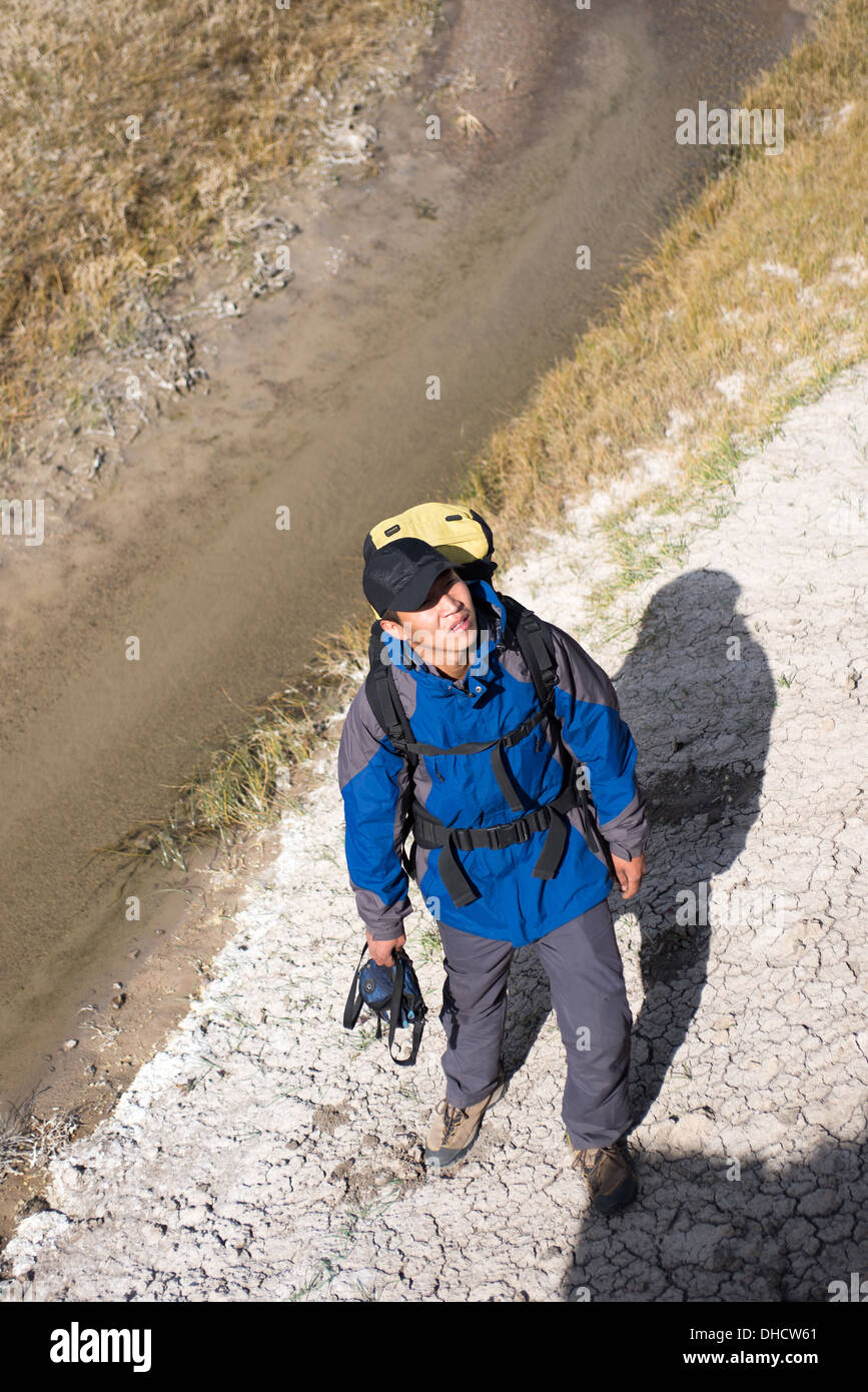 Hiker standing on the river side. high angle shot Stock Photo