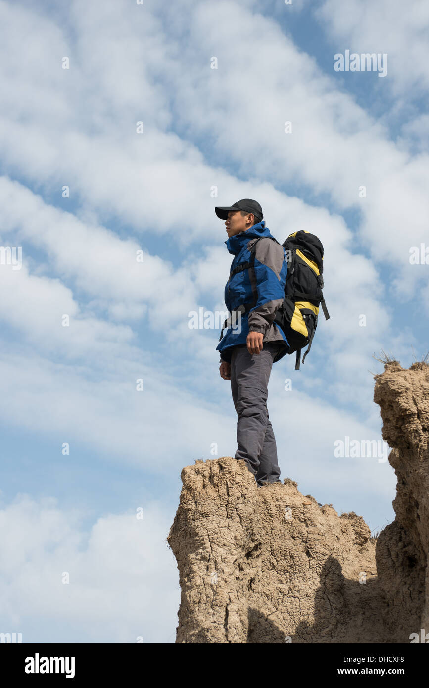 Hiker standing on cliffs hi-res stock photography and images - Alamy