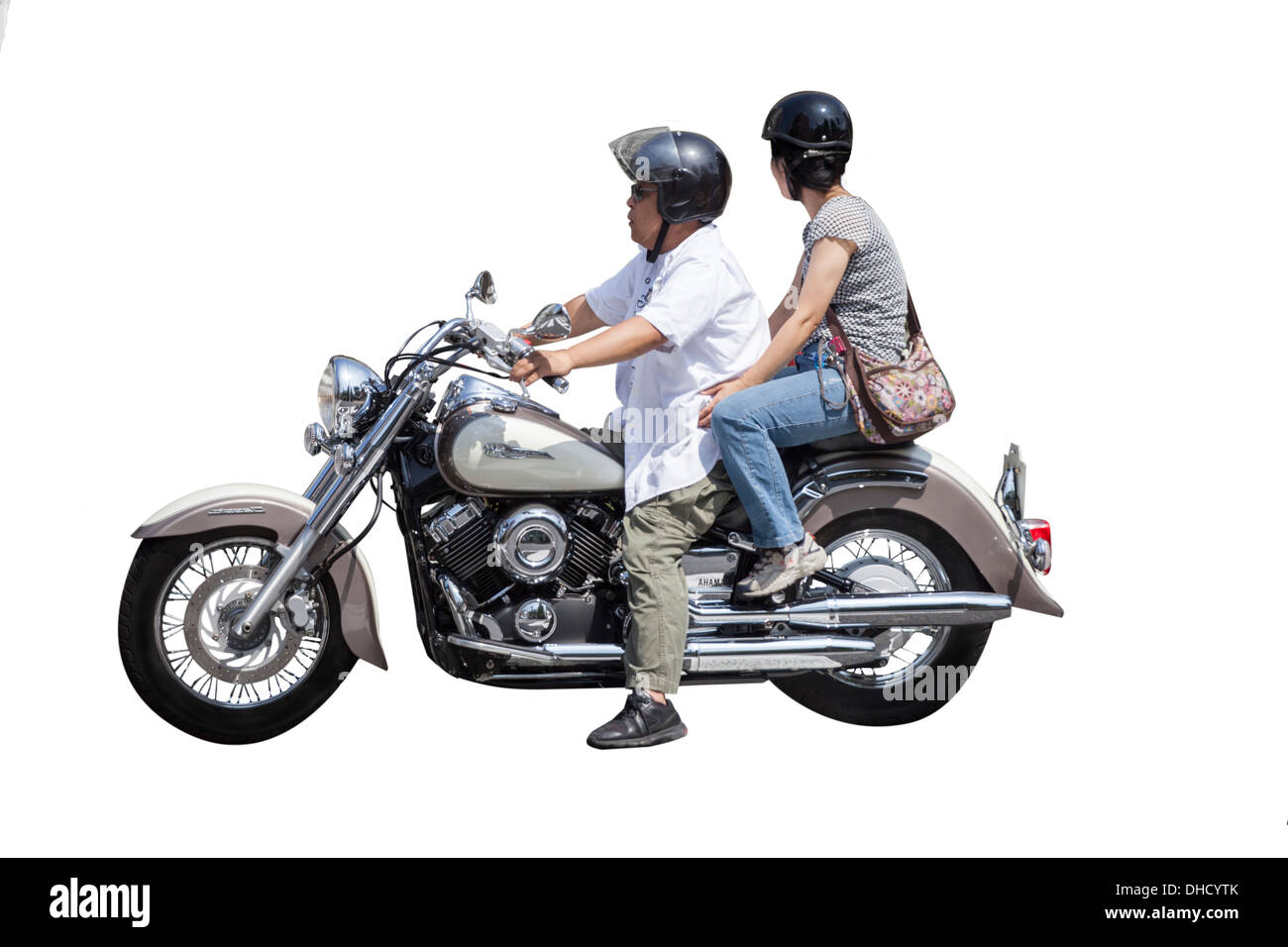 2 Japanese people on a motorbike in Tokyo, Japan Stock Photo