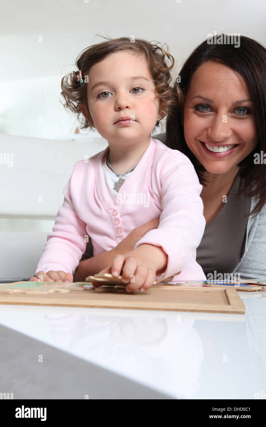 Mother and daughter with a jigsaw puzzle Stock Photo Alamy