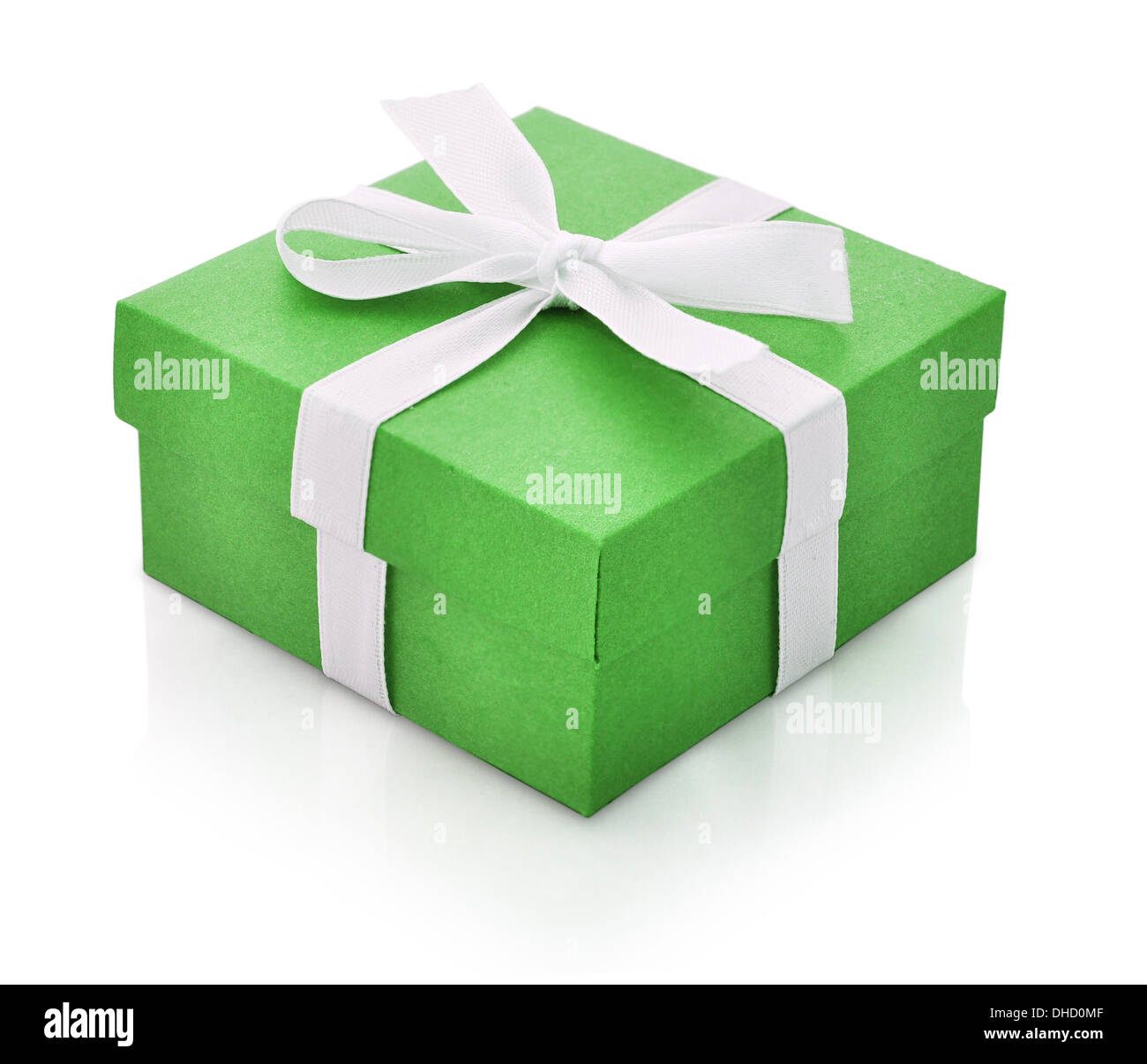 Green gift box with white ribbon isolated on white background. Clipping path included. Stock Photo