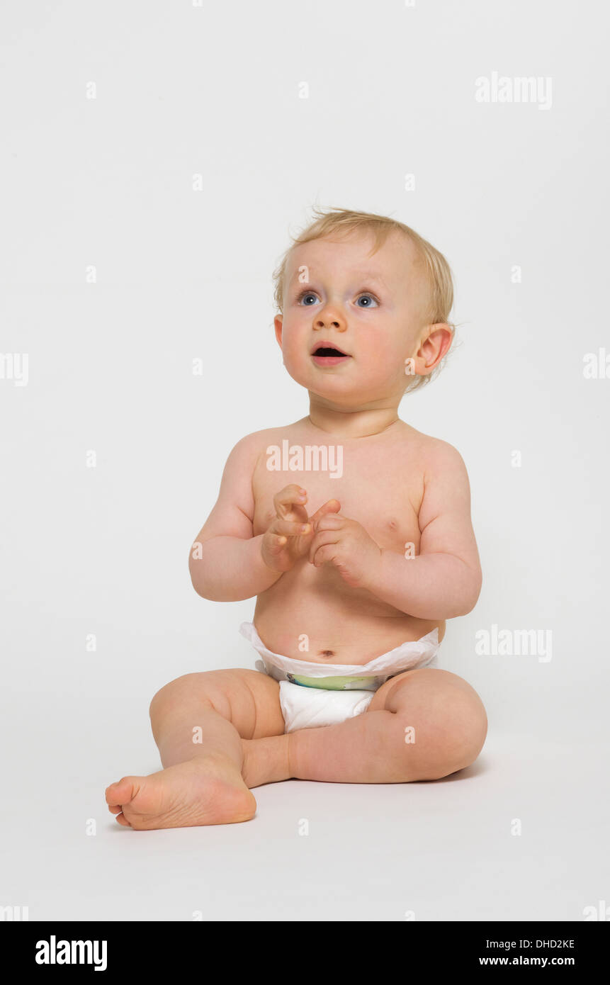 Baby boy wearing diapers against white backgound Stock Photo Alamy