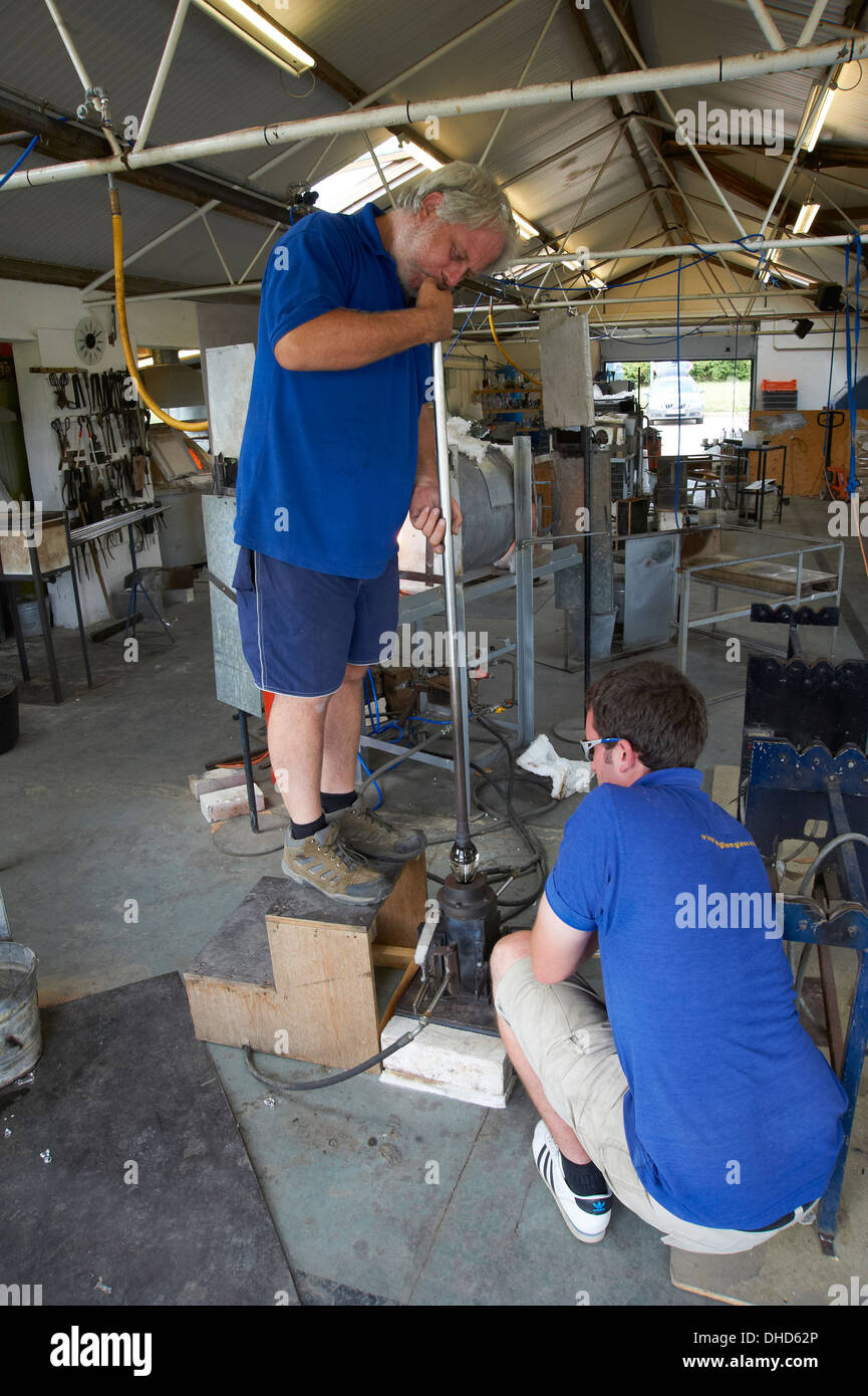 Langham glass worker blowing a glass bottle Norfolk Stock Photo Alamy