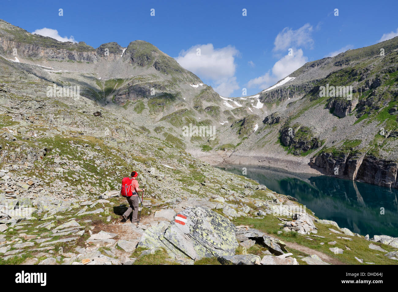Austria, Carinthia, Obervellach, Upper Tauern, Reisseckgruppe, Kleiner Muehldorfer See, female hiker on the way Stock Photo